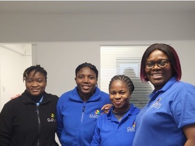 Christmas Party 2023 - Group of happy staff members posing together during festive celebration