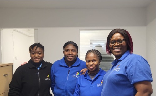 Professional Clover Support Group care team - four dedicated healthcare professionals in blue uniforms representing our specially trained, compassionate carers